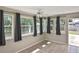 Bonus room with bright windows and tile floors and a ceiling fan at 5905 Olive Ave, Sarasota, FL 34231