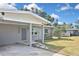 Well-maintained home with a carport, a freshly painted exterior, mature trees, and a spacious lawn at 5905 Olive Ave, Sarasota, FL 34231