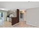Kitchen view with ample counter space, white cabinets, and an opening to the next room at 5905 Olive Ave, Sarasota, FL 34231
