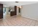 Spacious living room with tile flooring, a ceiling fan, and an open floor plan at 5905 Olive Ave, Sarasota, FL 34231