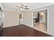 Living room featuring hardwood-style flooring, ceiling fan, and open access to the kitchen at 5905 Olive Ave, Sarasota, FL 34231