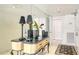 Inviting entryway with decorative mirror, accent table, and neutral decor, creating a welcoming first impression at 5966 Midnight Pass Rd # G-51 & G-58, Sarasota, FL 34242