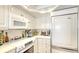 Charming white kitchen featuring modern appliances and ample storage at 5966 Midnight Pass Rd # G-51 & G-58, Sarasota, FL 34242