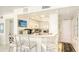 Charming white kitchen with breakfast bar and modern appliances, great for entertaining at 5966 Midnight Pass Rd # G-51 & G-58, Sarasota, FL 34242
