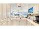 Well-lit kitchen with white cabinets and countertop, great for entertaining at 5966 Midnight Pass Rd # G-51 & G-58, Sarasota, FL 34242