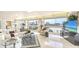 Bright open-concept living space featuring expansive windows with captivating beach and city views at 5966 Midnight Pass Rd # G-51 & G-58, Sarasota, FL 34242