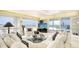 Bright living room boasting large windows with stunning ocean views and elegant decor at 5966 Midnight Pass Rd # G-51 & G-58, Sarasota, FL 34242