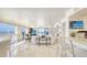 Bright living room featuring tile floors, water views, and elegant furnishings at 5966 Midnight Pass Rd # G-51 & G-58, Sarasota, FL 34242
