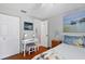 Bedroom featuring beach themed decor, desk, and double door closet at 6010 36Th Avenue W Cir # E, Bradenton, FL 34209