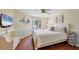 Bedroom with beach themed decor and a large window at 6010 36Th Avenue W Cir # E, Bradenton, FL 34209