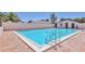 Inviting pool with brick trim, white coping, and clear blue water at 6010 36Th Avenue W Cir # E, Bradenton, FL 34209