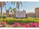 Cordova Villas community entrance sign surrounded by lush landscaping and vibrant flowers at 6010 36Th Avenue W Cir # E, Bradenton, FL 34209
