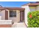 Attractive townhome facade highlighting the front door and lush tropical foliage at 6010 36Th Avenue W Cir # E, Bradenton, FL 34209
