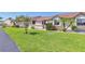 Charming single-story townhome with a well-maintained lawn and tropical landscaping at 6010 36Th Avenue W Cir # E, Bradenton, FL 34209