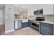 Updated kitchen with stainless steel appliances, modern cabinetry and countertops at 6010 36Th Avenue W Cir # E, Bradenton, FL 34209