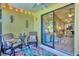 Relaxing screened porch with comfortable seating that leads to a spacious living room at 6010 36Th Avenue W Cir # E, Bradenton, FL 34209