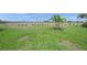 Large backyard featuring a well-maintained lawn and beautiful mature landscaping at 6244 Talon Preserve Dr, Nokomis, FL 34275