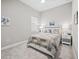 Cozy bedroom features a ceiling fan, carpet, and large window for natural light at 6244 Talon Preserve Dr, Nokomis, FL 34275