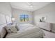 Carpeted bedroom with ceiling fan, boasts natural light and neutral tones at 6244 Talon Preserve Dr, Nokomis, FL 34275