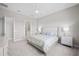 Neutral toned bedroom with carpet features ceiling fan, walk in closet, and ensuite bathroom at 6244 Talon Preserve Dr, Nokomis, FL 34275