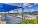 Well-maintained bocce ball courts with shade canopies and seating, surrounded by landscaping at 6244 Talon Preserve Dr, Nokomis, FL 34275