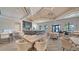 Spacious clubhouse featuring a large bar, tables, chairs, and an open floor plan for gatherings at 6244 Talon Preserve Dr, Nokomis, FL 34275
