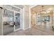 Bright clubhouse interior with wood flooring, modern lighting fixtures, and a glimpse of the common area at 6244 Talon Preserve Dr, Nokomis, FL 34275