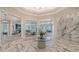 Elegant clubhouse interior with marble flooring, designer lighting, and stylish seating areas at 6244 Talon Preserve Dr, Nokomis, FL 34275