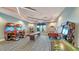 Fun game room featuring arcade games, shuffleboard, and air hockey for endless entertainment and social activities at 6244 Talon Preserve Dr, Nokomis, FL 34275