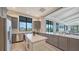 Modern kitchen featuring stainless steel appliances, granite countertops, and stylish gray cabinetry at 6244 Talon Preserve Dr, Nokomis, FL 34275