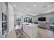 Spacious kitchen with a center island that opens to the living and dining areas overlooking the lanai at 6244 Talon Preserve Dr, Nokomis, FL 34275
