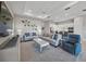 Cozy living room with a stylish decor, comfortable seating, and an open view of the kitchen at 6244 Talon Preserve Dr, Nokomis, FL 34275