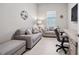 Cozy office space with neutral tones, comfortable seating, and a built-in desk area at 6244 Talon Preserve Dr, Nokomis, FL 34275