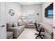 Cozy office space with neutral tones, comfortable seating, and a built-in desk area at 6244 Talon Preserve Dr, Nokomis, FL 34275
