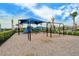 Playground with swings and a slide under shade, designed for outdoor fun in a safe environment at 6244 Talon Preserve Dr, Nokomis, FL 34275