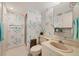 The bathroom features unique patterned wallpaper, a toilet, a shower, and a vanity sink at 6285 Midnight Pass Rd # 403, Sarasota, FL 34242