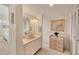 Clean and bright bathroom featuring single vanity and ample storage space at 6285 Midnight Pass Rd # 403, Sarasota, FL 34242