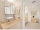 Well-maintained bathroom featuring vanity and convenient linen storage at 6285 Midnight Pass Rd # 403, Sarasota, FL 34242