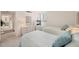 This bedroom features two twin beds, a dresser, and a light-filled window view at 6285 Midnight Pass Rd # 403, Sarasota, FL 34242