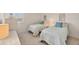 Bright bedroom featuring twin beds, bright natural light and calming coastal decor at 6285 Midnight Pass Rd # 403, Sarasota, FL 34242