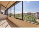 Enjoy this screened lanai with views of the lush community landscaping and pool at 6285 Midnight Pass Rd # 403, Sarasota, FL 34242