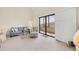Open concept living area featuring comfortable seating, ample natural light, and sliding doors leading to outdoor balcony at 6285 Midnight Pass Rd # 403, Sarasota, FL 34242