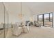 Bright living room featuring dining area, balcony access, and comfortable seating at 6285 Midnight Pass Rd # 403, Sarasota, FL 34242