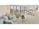 Cozy living room with plush seating, a glass table, and large windows providing plenty of natural light at 6285 Midnight Pass Rd # 403, Sarasota, FL 34242