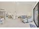 Spacious living area with a dining table, comfortable seating, a large mirror, and ample natural light at 6285 Midnight Pass Rd # 403, Sarasota, FL 34242