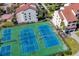 Aerial view showcasing the community's tennis courts, perfect for active residents seeking recreational opportunities at 6285 Midnight Pass Rd # 403, Sarasota, FL 34242