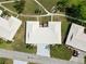 Overhead community view showcasing manicured lawns and white rooftops with palm trees at 6615 12Th Ave W W Ave, Bradenton, FL 34209