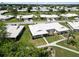 Aerial view of a community showcasing beautiful landscaping and an enclosed lanai at 6615 12Th Ave W W Ave, Bradenton, FL 34209