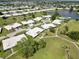 Scenic aerial view highlighting the residential community with green spaces, a pond, and convenient walkways at 6615 12Th Ave W W Ave, Bradenton, FL 34209