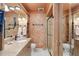 Elegant bathroom boasting a granite countertop, framed mirror, and a glass-enclosed shower at 6615 12Th Ave W W Ave, Bradenton, FL 34209